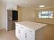 Spacious kitchen with white cabinets, stainless steel refrigerator, and center island at 2422 Clarissa Nw Dr, Atlanta, GA 30318