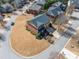 Aerial view of a two-story townhouse with a well-manicured lawn and landscaped surroundings at 4790 Maristone Landing Way, Cumming, GA 30040