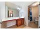 Bathroom with a large mirror, cabinet space, and shower-tub at 4790 Maristone Landing Way, Cumming, GA 30040