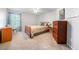 Bedroom featuring full size bed, dresser, and window at 4790 Maristone Landing Way, Cumming, GA 30040