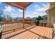 Back deck complete with wood pergola, string lights, and grill that provides a wonderful space for relaxation and entertainment at 4790 Maristone Landing Way, Cumming, GA 30040