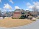 Charming two-story townhouse with brick facade and well-maintained landscaping in a suburban neighborhood at 4790 Maristone Landing Way, Cumming, GA 30040