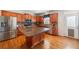 Modern kitchen featuring stainless steel appliances, granite countertops, and a large island at 4790 Maristone Landing Way, Cumming, GA 30040