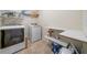 Laundry room with washer, dryer, shelves, and tile flooring at 4790 Maristone Landing Way, Cumming, GA 30040