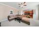 Cozy living room with a sectional sofa and view of the kitchen at 4790 Maristone Landing Way, Cumming, GA 30040