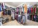 Walk in closet with clothing, shoes, and hanging racks at 4790 Maristone Landing Way, Cumming, GA 30040