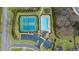 Aerial view of a community pool, tennis courts, a playground, and ample parking at 7330 Olivia View Ct, Cumming, GA 30028