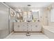 Traditional bathroom featuring a bath and shower combination and dual sink vanity at 2200 Gleneagle Nw Ct, Conyers, GA 30012