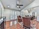 Open dining room with large table, vaulted ceiling, and shuttered windows at 1012 Jubilee Way, Powder Springs, GA 30127