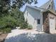 Home exterior with stone accents, stucco, and a well-maintained driveway at 1012 Jubilee Way, Powder Springs, GA 30127