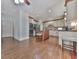 Bright, modern kitchen featuring an island, stainless steel appliances and wood floors at 1012 Jubilee Way, Powder Springs, GA 30127