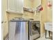 Laundry room featuring modern appliances and storage at 1012 Jubilee Way, Powder Springs, GA 30127