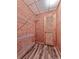 Well-organized pantry with wire shelving and wood-look flooring, plus a wooden door at 1012 Jubilee Way, Powder Springs, GA 30127