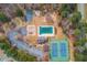 Aerial view of community amenities including a pool, tennis court, and basketball court at 1042 Wildwood Wake Bnd, Dacula, GA 30019