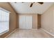 Bedroom featuring neutral paint, large closet, and a large window for natural light at 1042 Wildwood Wake Bnd, Dacula, GA 30019