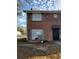 View of two-story townhouse with red brick exterior and traditional-style windows and covered entryway at 1339 Lakeview Nw Dr, Conyers, GA 30012