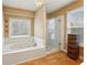 Bathroom featuring a soaking tub with a separate glass enclosed shower at 2795 Kakki Ct, Marietta, GA 30062