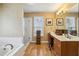 A serene bathroom with dual sinks, soaking tub and separate glass enclosed shower at 2795 Kakki Ct, Marietta, GA 30062