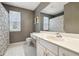 Bathroom featuring large mirror, white countertops, and white tile flooring at 2795 Kakki Ct, Marietta, GA 30062