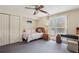 Cozy bedroom with natural light, a ceiling fan, closet, and adjacent workspace at 2795 Kakki Ct, Marietta, GA 30062