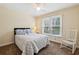 Bedroom featuring carpet, rocking chair, and a ceiling fan at 2795 Kakki Ct, Marietta, GA 30062