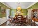 Formal dining room with a unique chandelier and views from the windows at 2795 Kakki Ct, Marietta, GA 30062