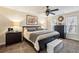 Comfortable main bedroom featuring a ceiling fan, and dark wood furniture at 2795 Kakki Ct, Marietta, GA 30062