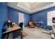 Bedroom with blue walls, a ceiling fan, a closet door, and window with natural light, plus desk and seating at 3999 Craggy Perch, Douglasville, GA 30135