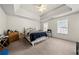 Carpeted main bedroom with white ceiling with fan and natural light through large windows creates a cozy retreat at 3999 Craggy Perch, Douglasville, GA 30135