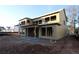 Image shows a house in the framing stage with a covered patio area, on a construction lot at 436 Maypop Lane, Woodstock, GA 30188