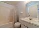 This bathroom features a shower with tub, toilet, sink, and vanity at 715 Wallington Way, Lawrenceville, GA 30046