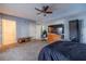 Spacious bedroom with a ceiling fan and a private bathroom entrance to the left of the image at 715 Wallington Way, Lawrenceville, GA 30046