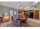 Cozy dining room with natural lighting, access to kitchen, and an adjacent outdoor patio at 715 Wallington Way, Lawrenceville, GA 30046