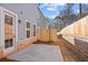 View of a backyard with a small concrete patio and a wooden fence at 1024 Rose Dr, Marietta, GA 30060