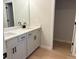 Modern bathroom featuring double vanity, quartz countertops, and a walk-in closet at 1024 Rose Dr, Marietta, GA 30060