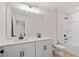 Bright bathroom featuring double sinks, sleek fixtures and a separate tub and shower at 1024 Rose Dr, Marietta, GA 30060