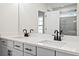 Modern bathroom featuring double sinks, sleek black faucets and a large mirror at 1024 Rose Dr, Marietta, GA 30060