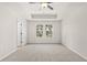 A neutral-toned bedroom with recessed ceiling, ceiling fan, and double windows at 1024 Rose Dr, Marietta, GA 30060