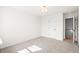 Clean, carpeted bedroom with natural light, modern ceiling fixture, and white trim at 1024 Rose Dr, Marietta, GA 30060