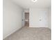 Carpeted bedroom with white trim and doors leading to other parts of the home at 1024 Rose Dr, Marietta, GA 30060