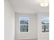 Bright bedroom with two windows allowing for ample natural light at 1024 Rose Dr, Marietta, GA 30060