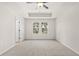 Bright bedroom features a ceiling fan, neutral carpet, and double window views at 1024 Rose Dr, Marietta, GA 30060