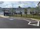 Street view of new townhomes with parking areas, landscaping, and community gathering spaces at 1024 Rose Dr, Marietta, GA 30060