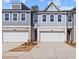 Charming townhome exterior with attached garage and neutral paint scheme, offering modern curb appeal at 1024 Rose Dr, Marietta, GA 30060