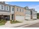 Attractive townhomes featuring a brick facade, attached garages, and neat landscaping, highlighting community living at 1024 Rose Dr, Marietta, GA 30060