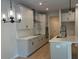 Modern kitchen with sleek countertops, stainless steel appliances, a stylish chandelier, and a central island at 1024 Rose Dr, Marietta, GA 30060