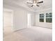 Spacious main bedroom featuring ceiling fan, recessed lighting, and natural light at 1024 Rose Dr, Marietta, GA 30060