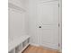 Mud room with built in bench, storage and coat rack for easy organization when entering or leaving the home at 1024 Rose Dr, Marietta, GA 30060