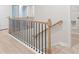 Staircase featuring natural wood and black metal railing at 1024 Rose Dr, Marietta, GA 30060