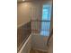 Staircase with wooden rails and black iron spindles leading to the upper level at 1024 Rose Dr, Marietta, GA 30060